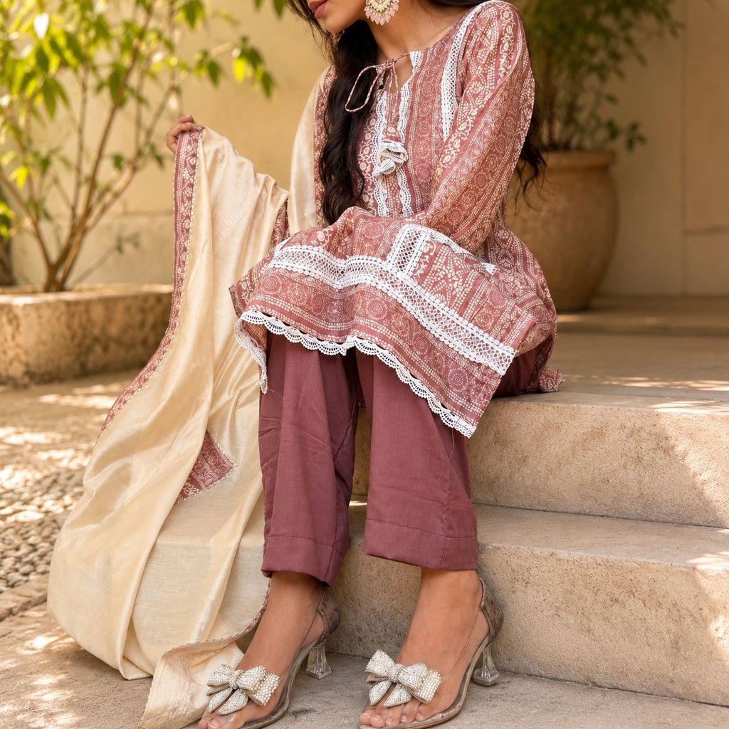 Woman in traditional outfit sitting on steps outdoors